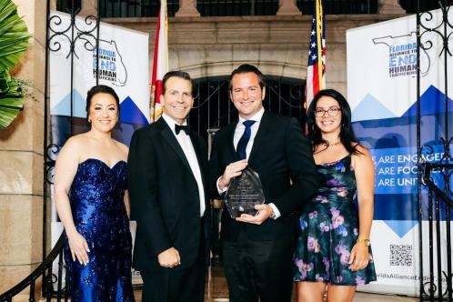 Florida Alliance Executive Director Erin Collins and Representative Toby Overdorf with Hope Award - Trailblazer recipients Kyle and Tiffany Greene, Kyle G's Restaurants